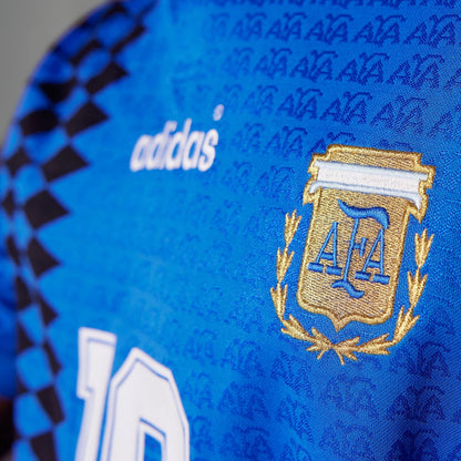 Close-up of a blue sports jersey with Adidas and AFA logos.