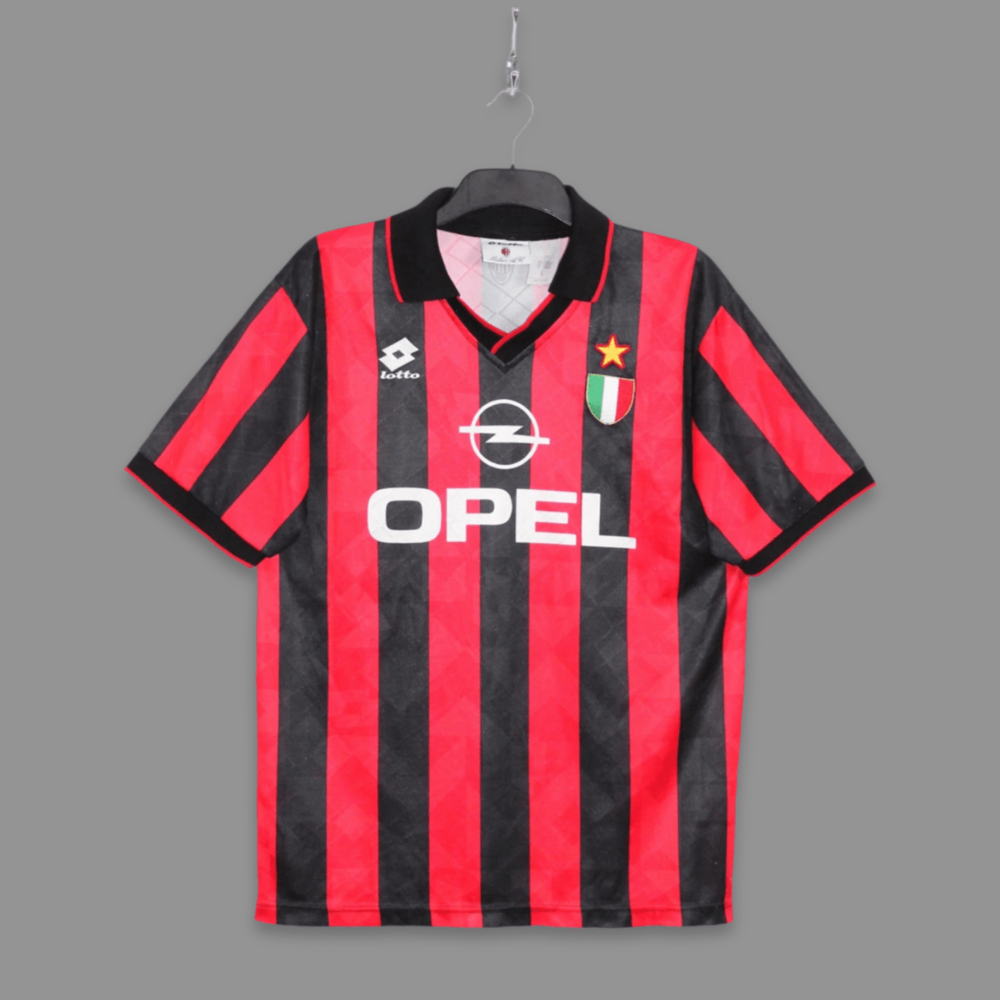 Black and red striped sports jersey with Opel logo on a gray background