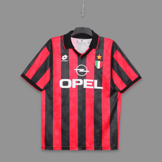 Black and red striped sports jersey with Opel logo on a gray background